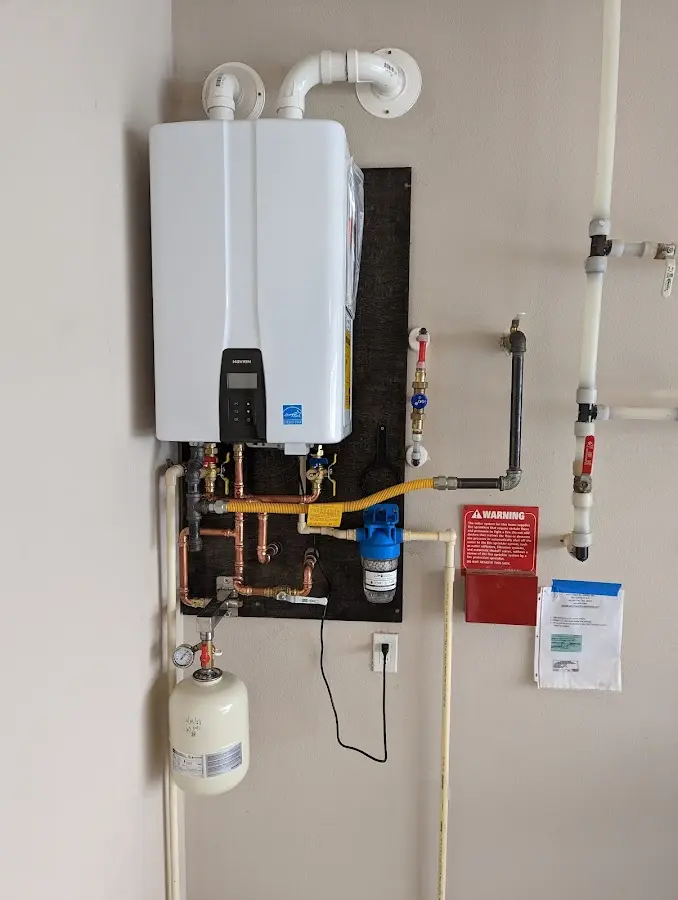 Professional plumber installing copper piping in a Yucaipa home